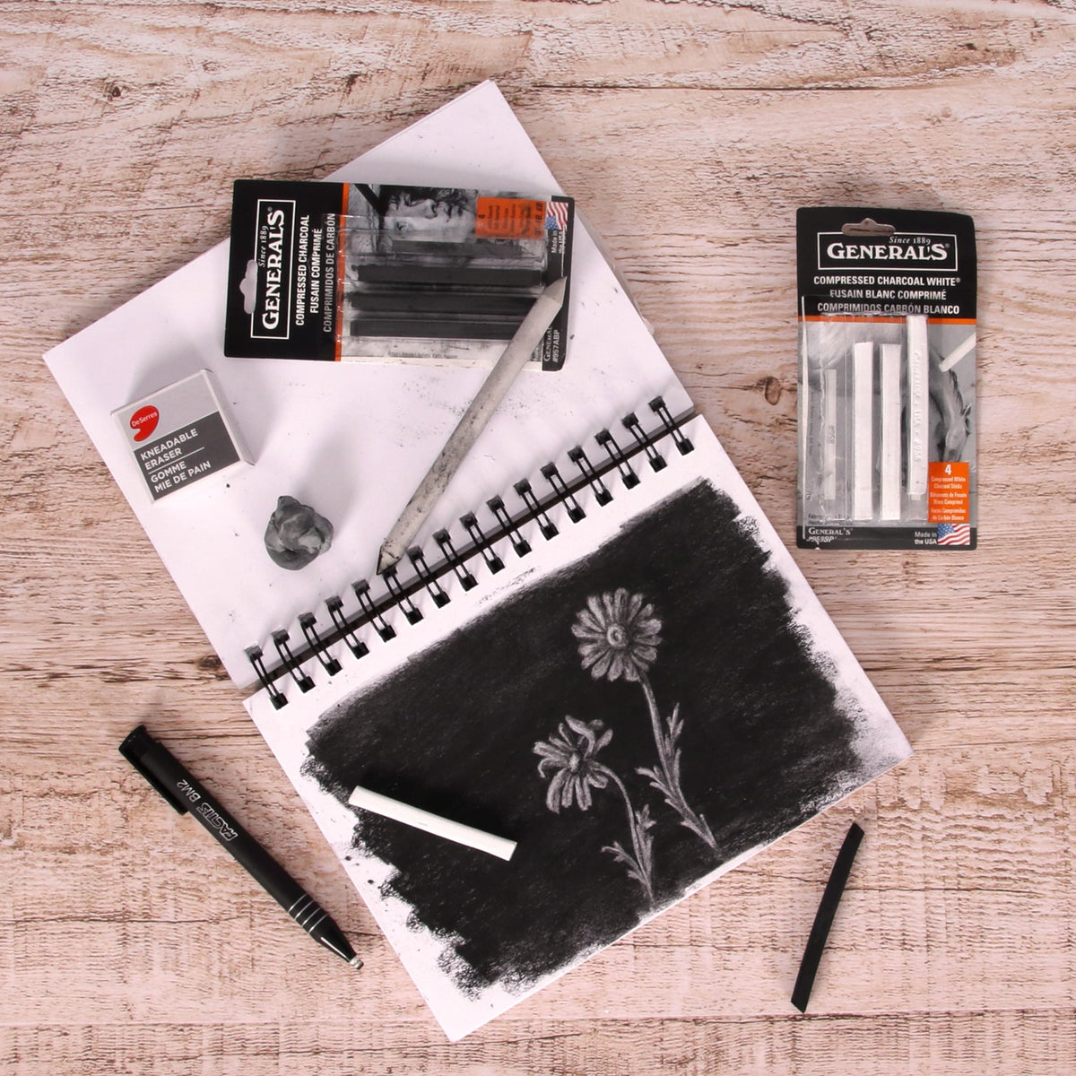 Drawing with an eraser and charcoal