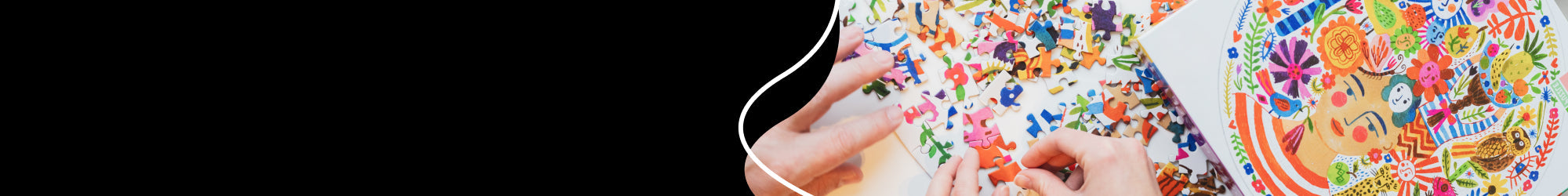 A hand putting some puzzle pieces