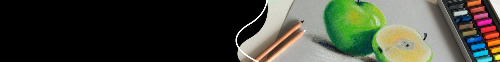 pastels and pencils in a wooden box